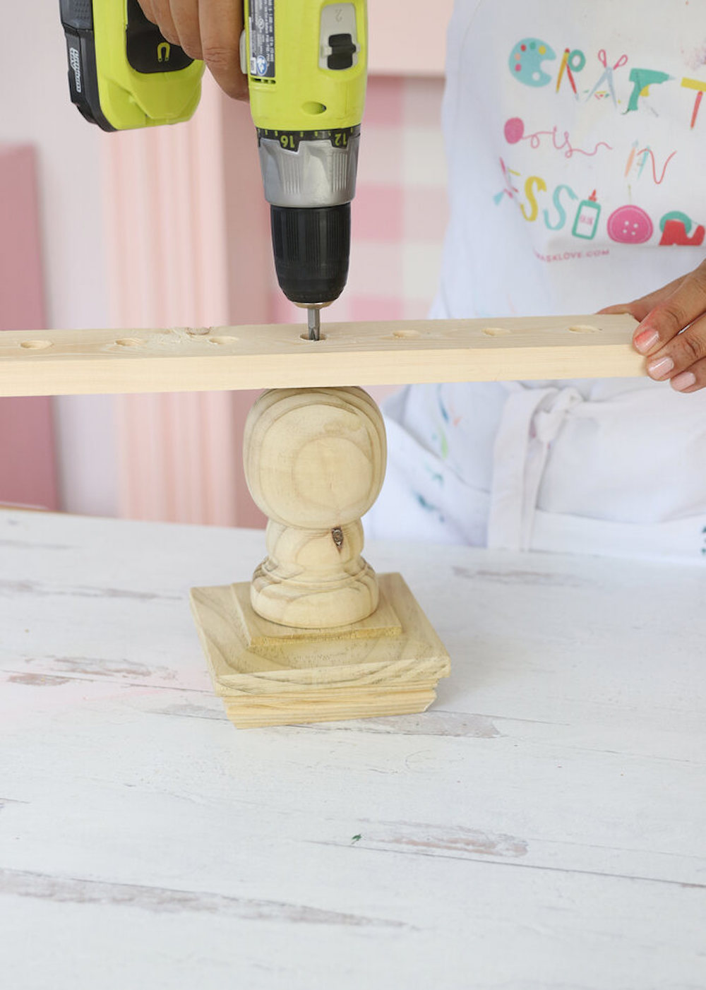 Drill wood board into pine ball top